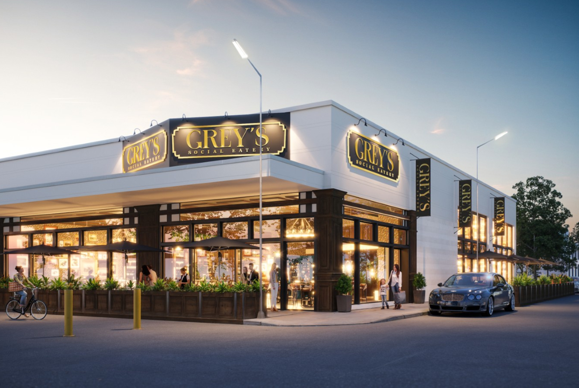 A corner restaurant building with white walls, large glass windows, and black trim illuminated at dusk. Multiple signs read “GREY’S SOCIAL EATERY,” with outdoor seating, pedestrians, and parked cars along the street.